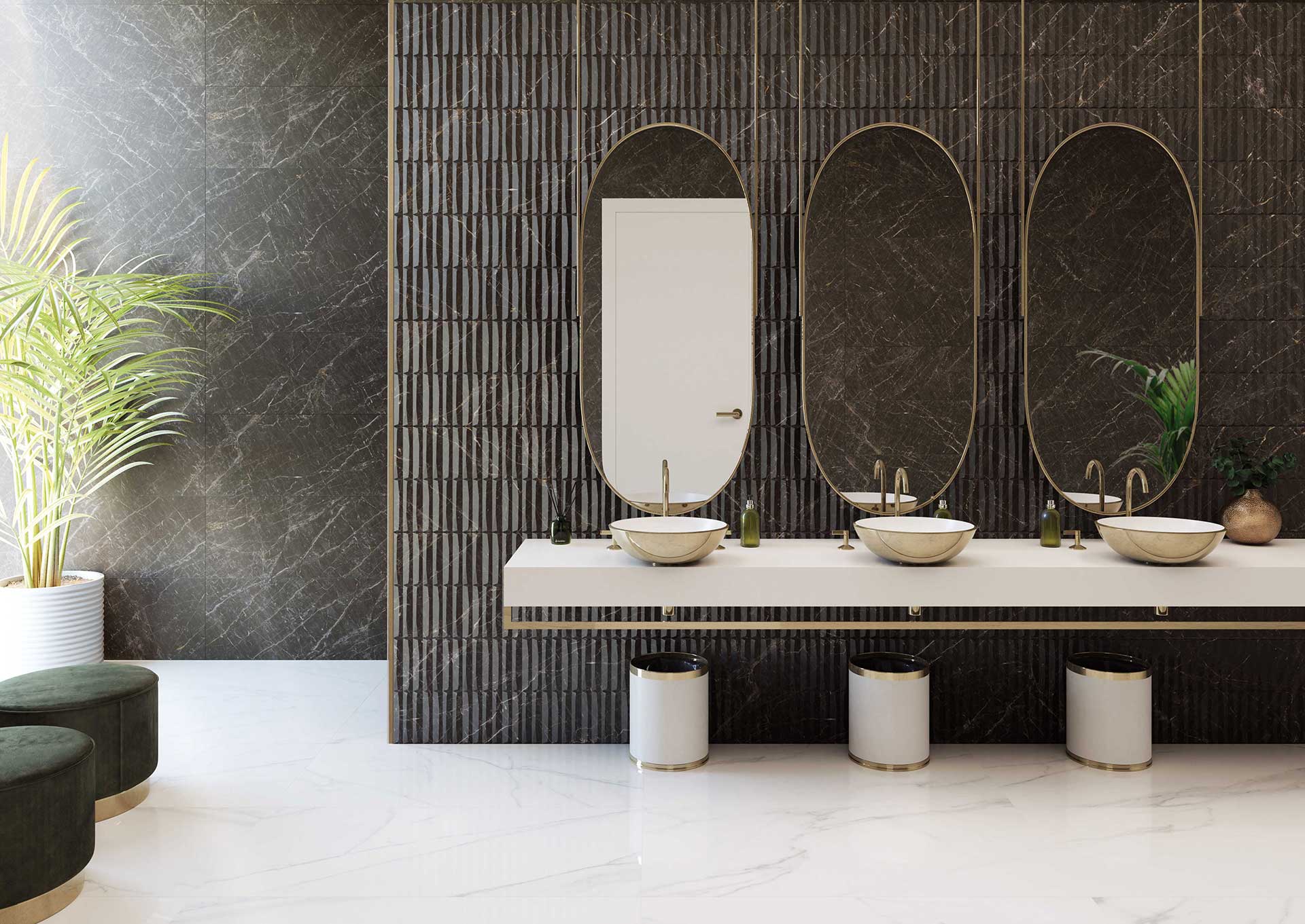 Ambiente de baño TAU con lavabos de piedra, espejos verticales y revestimiento oscuro
